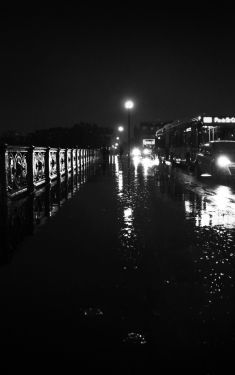 Luc Dartois 2019 - Paris by night under the rain, Mirabeau Bridge